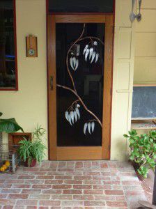 Fly wire door screen with galvanised iron and copper gum leaf design.