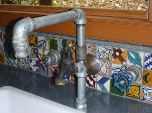 Hand crafted industrial kitchen taps with additional filtered water tap.