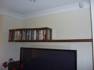 Metal DVD rack and shelf feature.